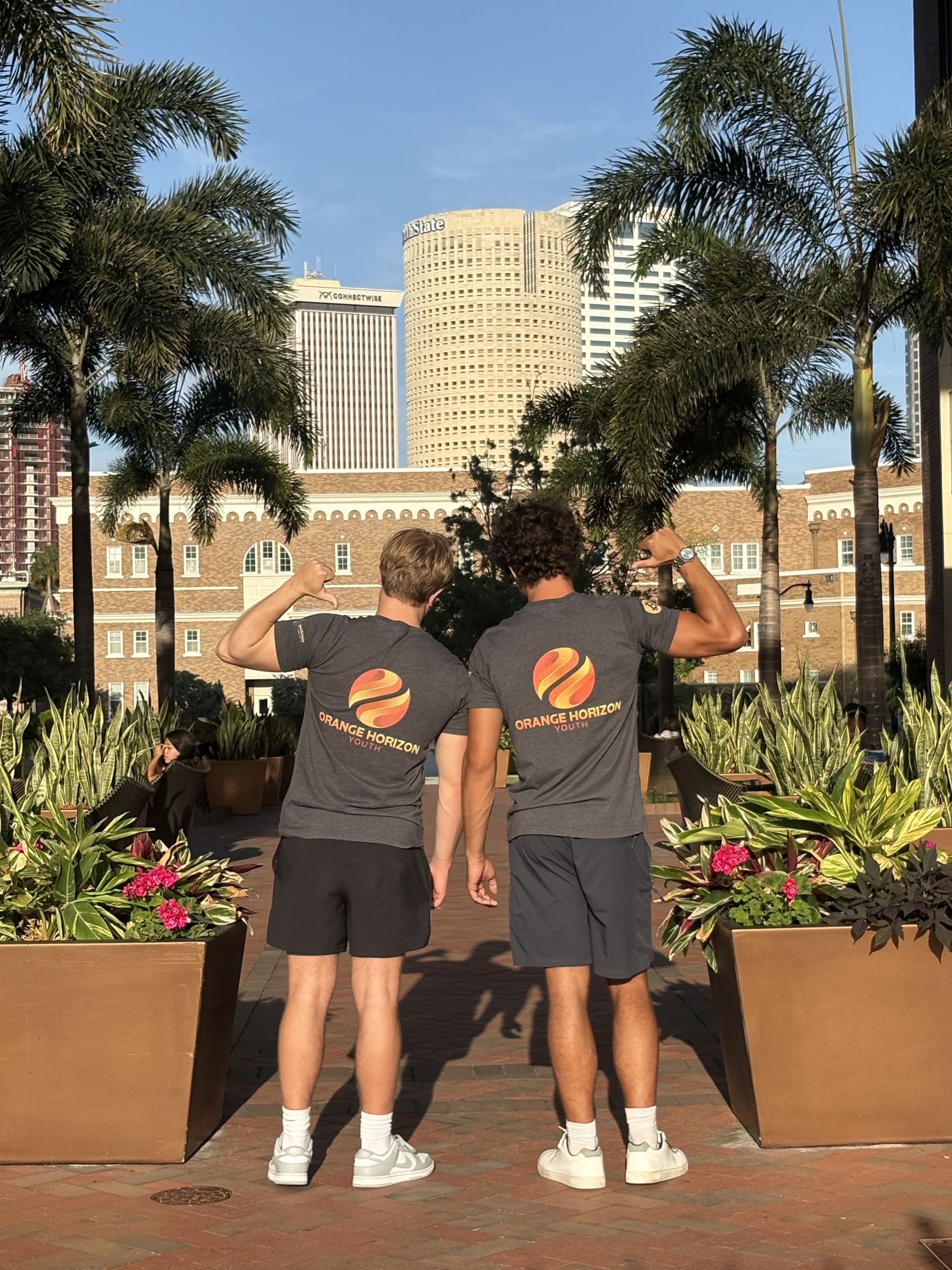 Orange Horizon team in front of the Tampa skyline